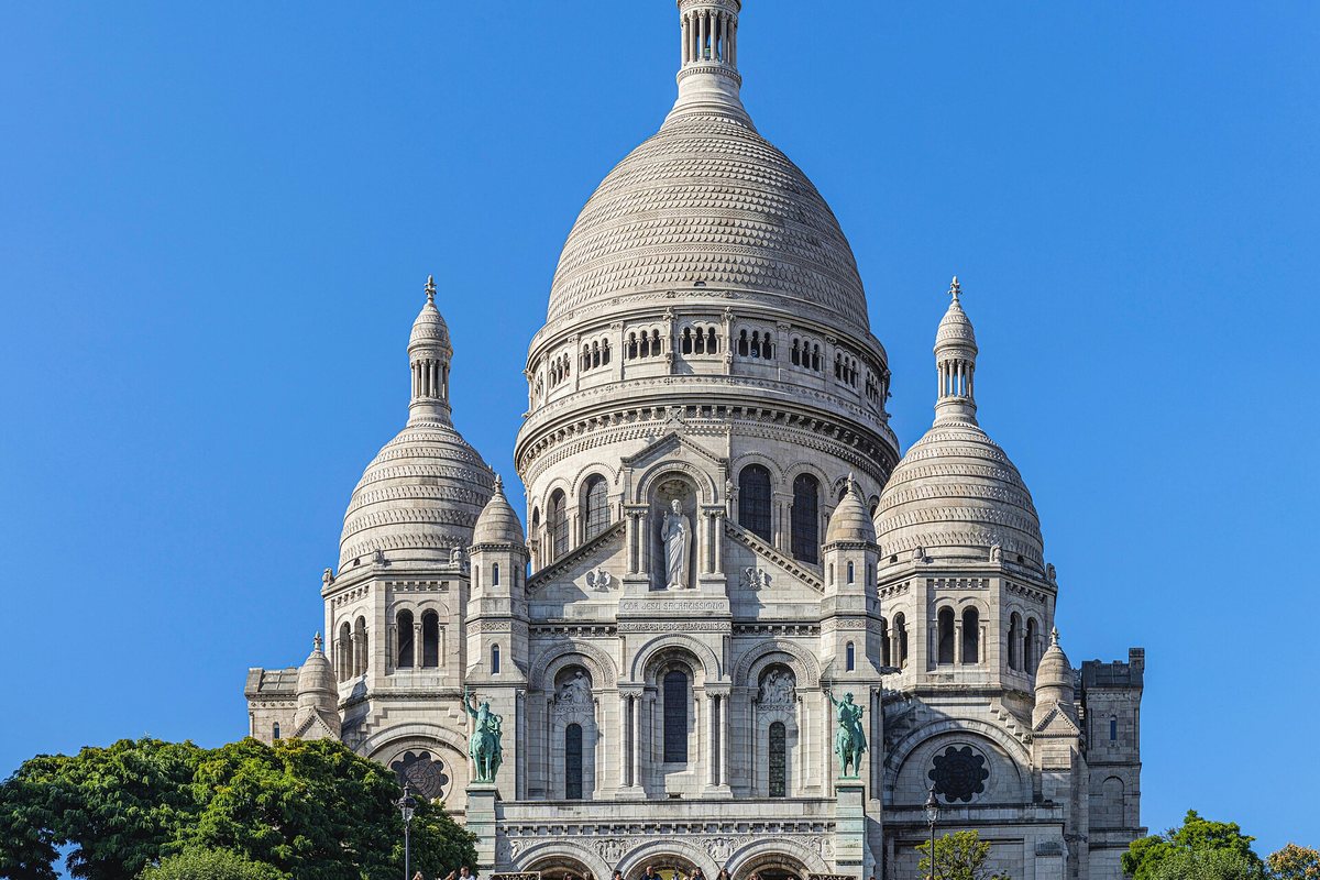 A closer view of the domes of the Sacré-Cœur basilica in Paris