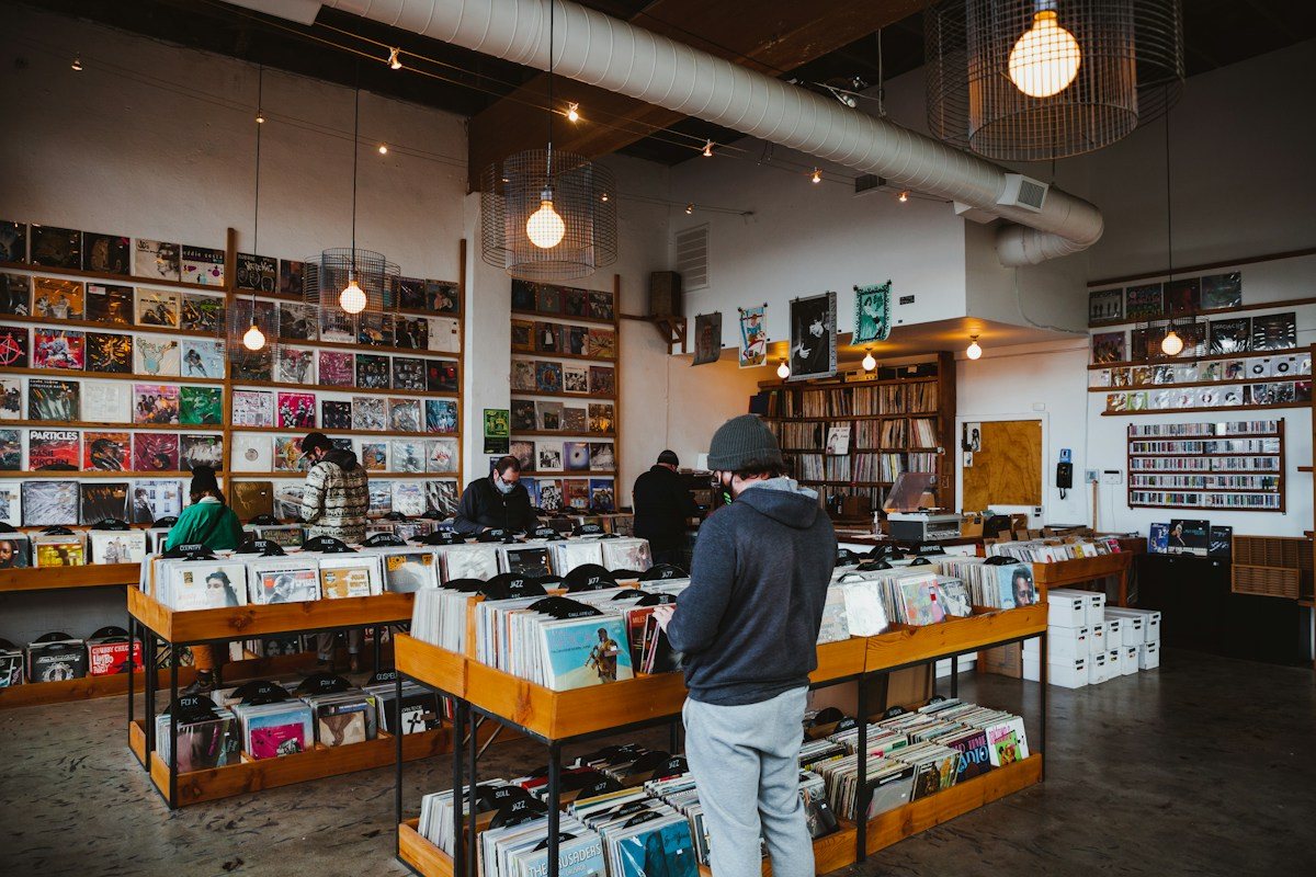A customer browses vinyl in a spacious record shop