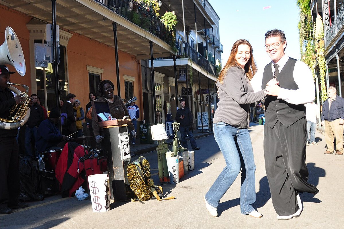 A couple dances to a street band in New Orleans in 2010