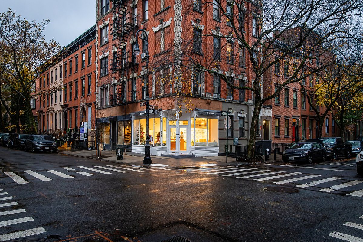 An illuminated storefront at West 4th and Bank Street in Greenwich Village, New York